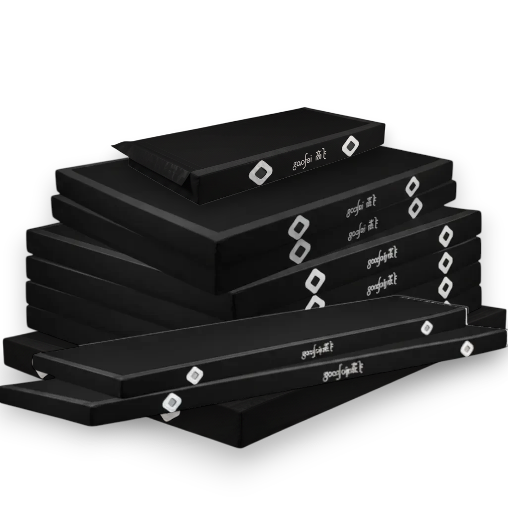 UK Gym Pits FIG approved black parallel bars landing mats stacked together, featuring durable PVC and Velcro flaps.