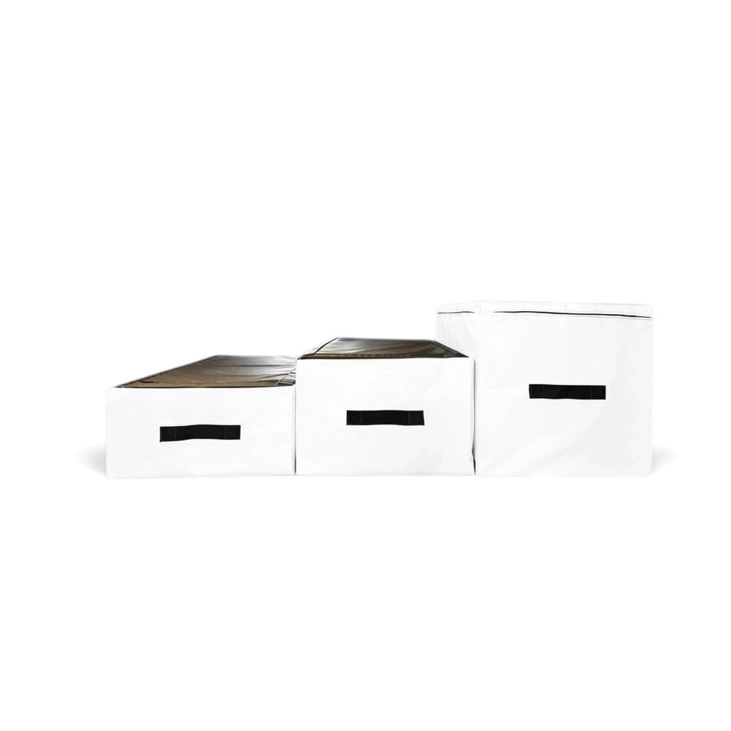 UK Gym Pits parkour jumping blocks in white PVC with black carry handles, arranged in a set of three different heights.