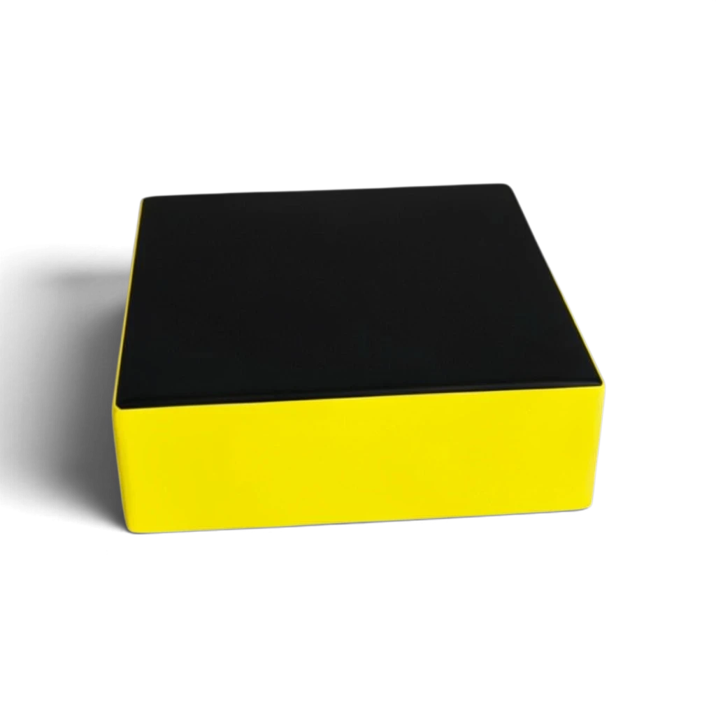 UK Gym Pits parkour stepping block with a black top and yellow sides made from durable PVC and high-density foam.