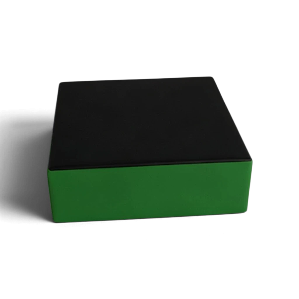 UK Gym Pits parkour stepping block with a black top and green sides made from durable PVC and high-density foam