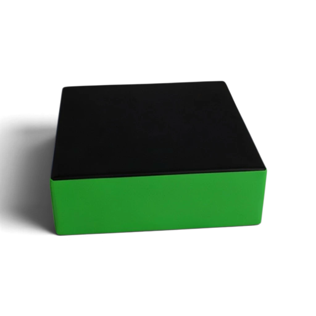 UK Gym Pits parkour stepping block with a black top and green sides, made of durable PVC and high-density foam.