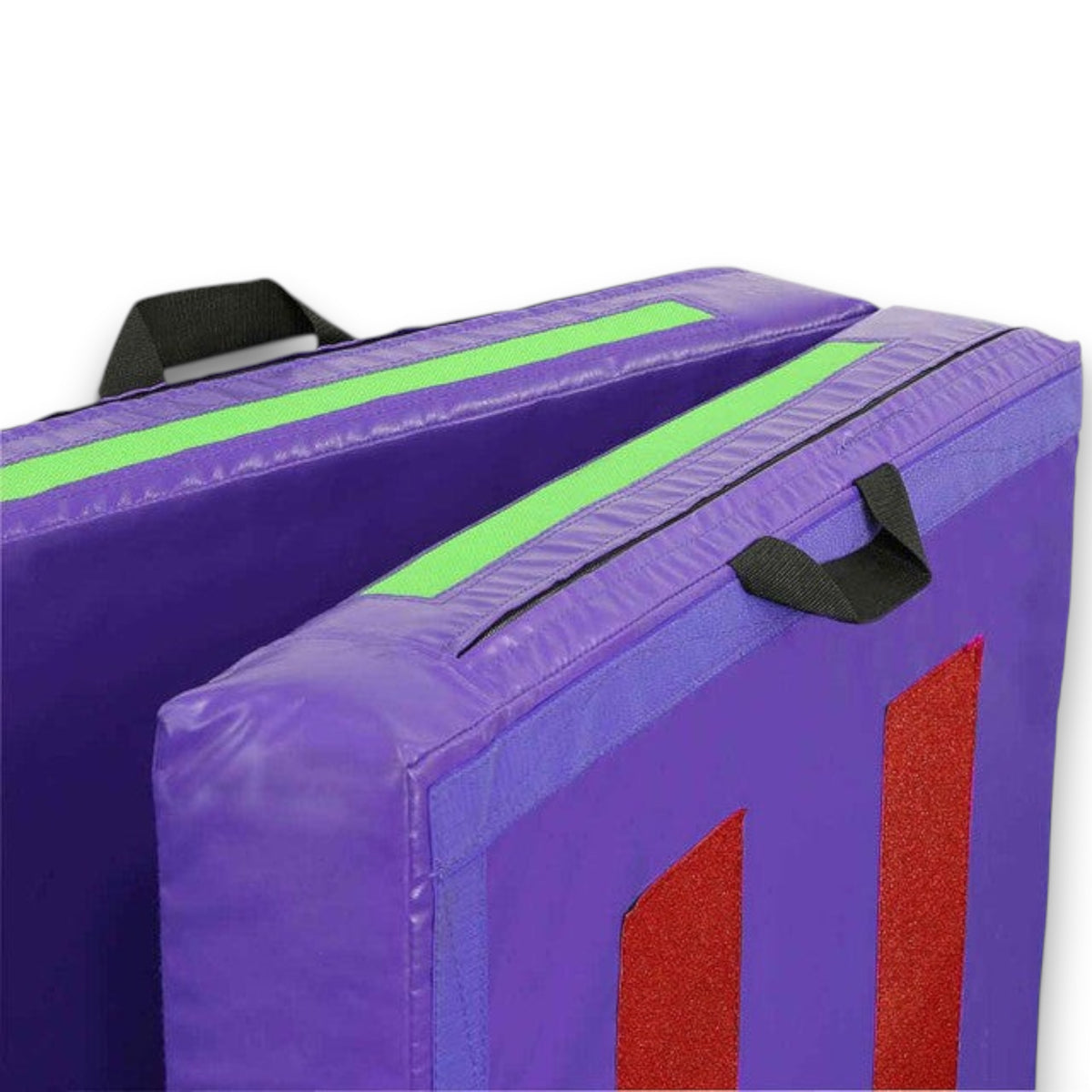 UK Gym Pits purple practice crash mat with green velcro strips, black carry handles, and red non-skid base details.