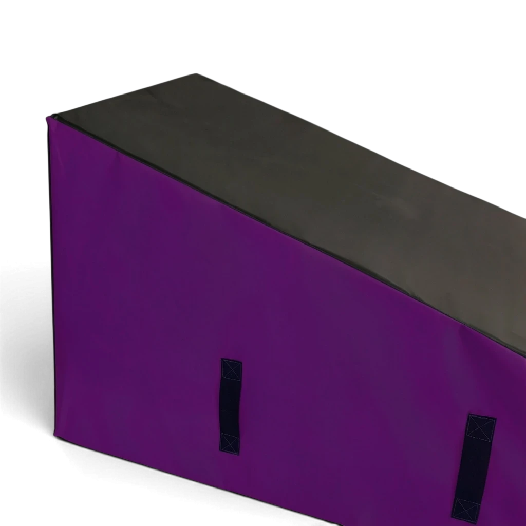 UK Gym Pits purple and black foam wedge block for parkour and freestyle gymnastics training with carry handles.