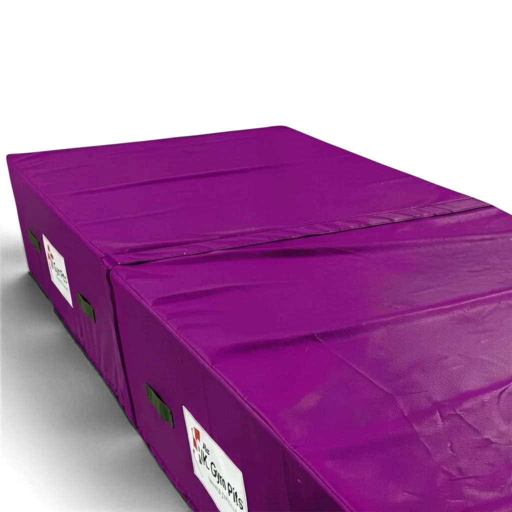 UK Gym Pits purple high-density foam track run-up block with anti-slip base and heavy-duty handles for gymnastics.