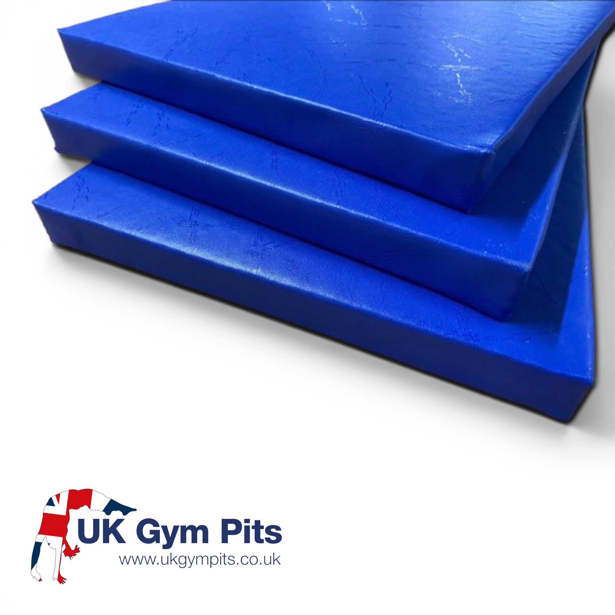 UK Gym Pits royal blue shock-absorbing foam padding sheets with heavy-duty PVC cover for gym walls and pits.