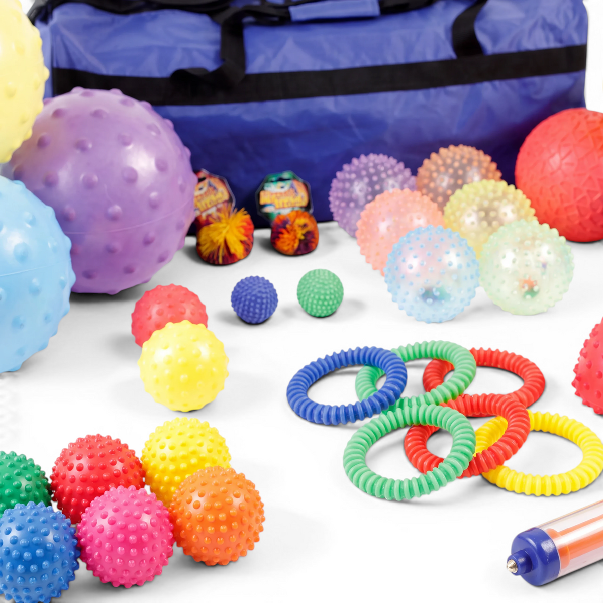 UK Gym Pits 35-piece sensory ball set with textured tactile balls, rings, and a blue storage holdall for motor skills.