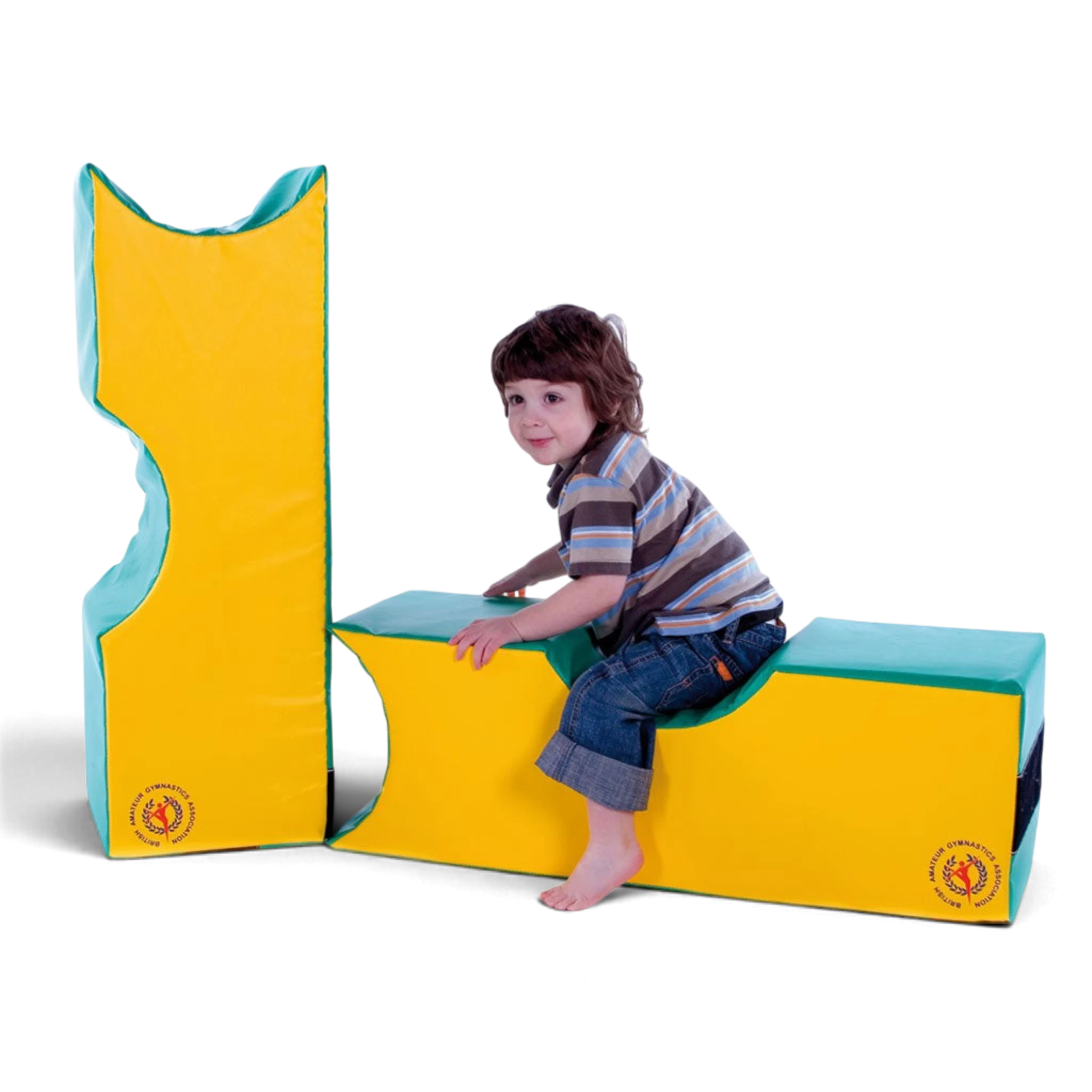 UK Gym Pits soft play foam shapes in yellow and green being used by a young child for active play and motor skills