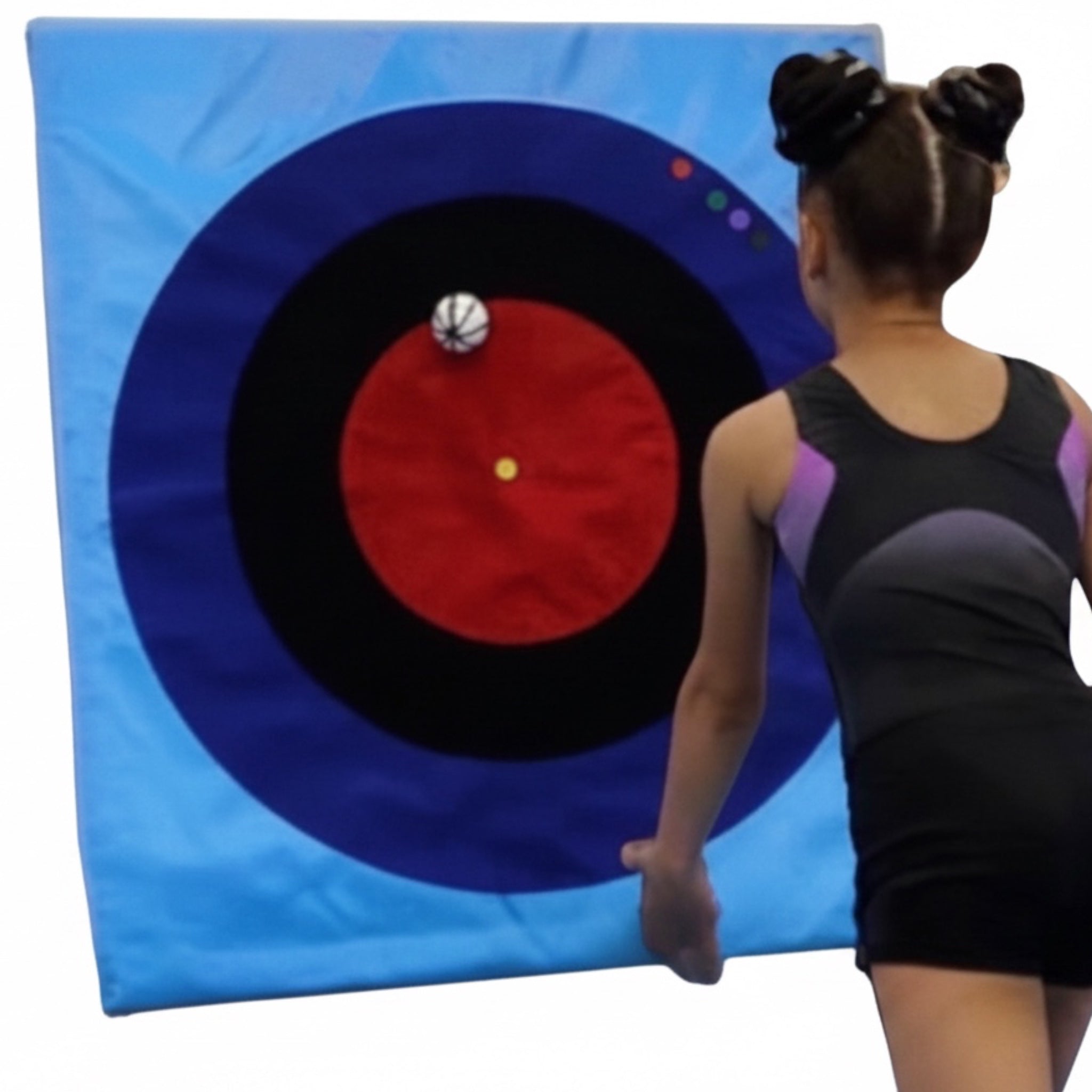 UK Gym Pits Spencer Spot Landing Dot target mat with a gymnast practicing precision landings on the bullseye