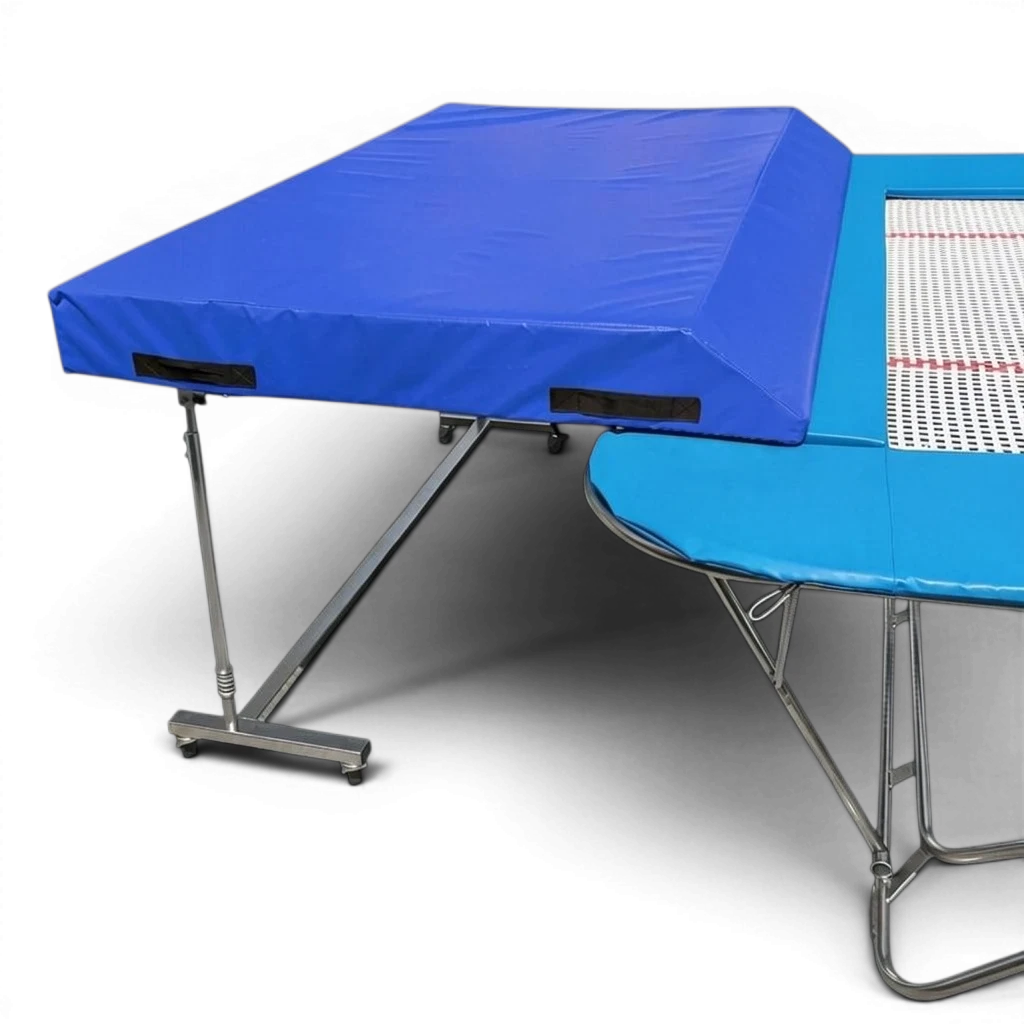 UK Gym Pits international spotting end deck with blue PVC wedge mat attached to a trampoline frame.