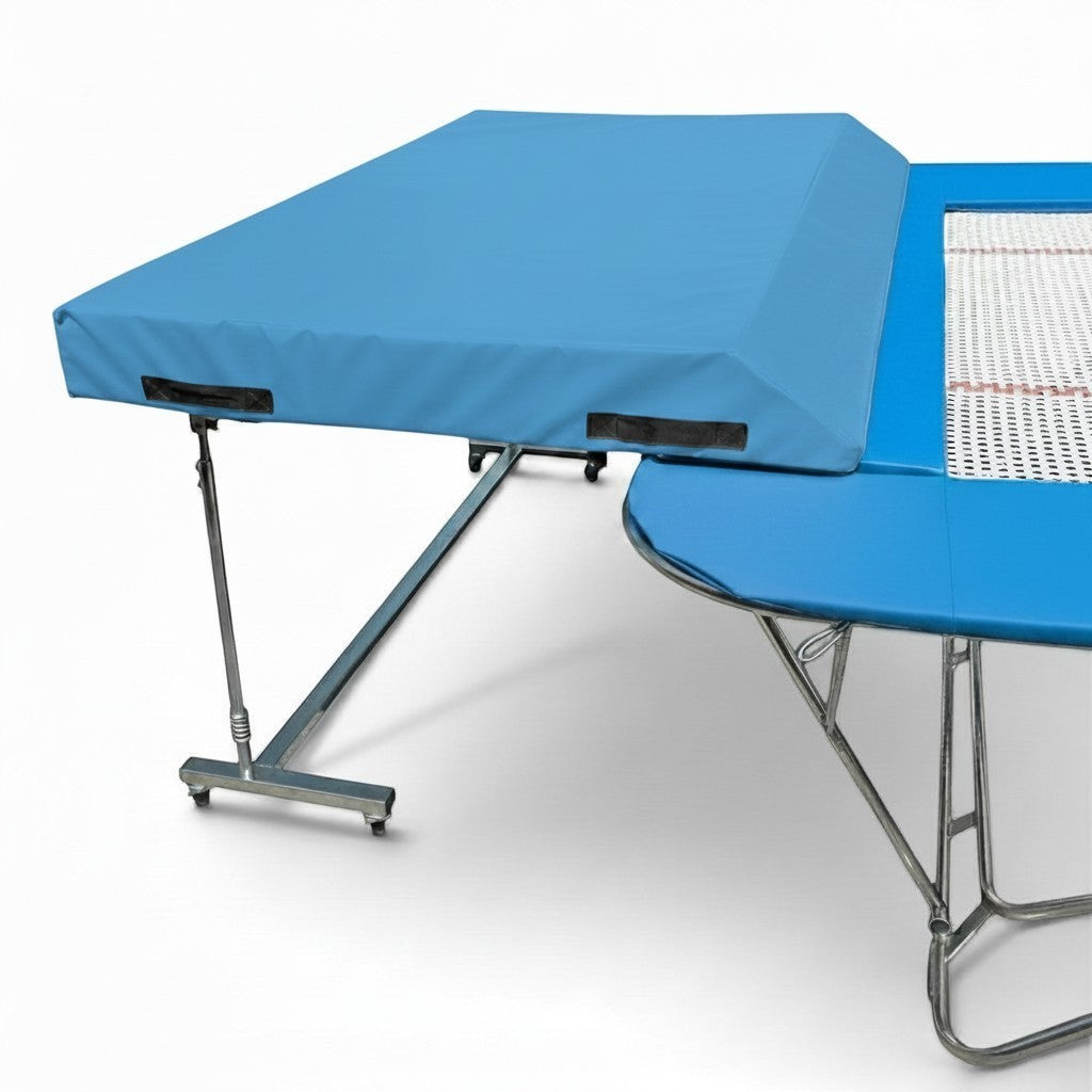 UK Gym Pits international spotting end deck with blue safety mat attached to a trampoline frame