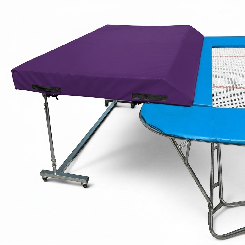 UK Gym Pits standard spotting end deck with a purple wedged safety mat attached to a trampoline frame
