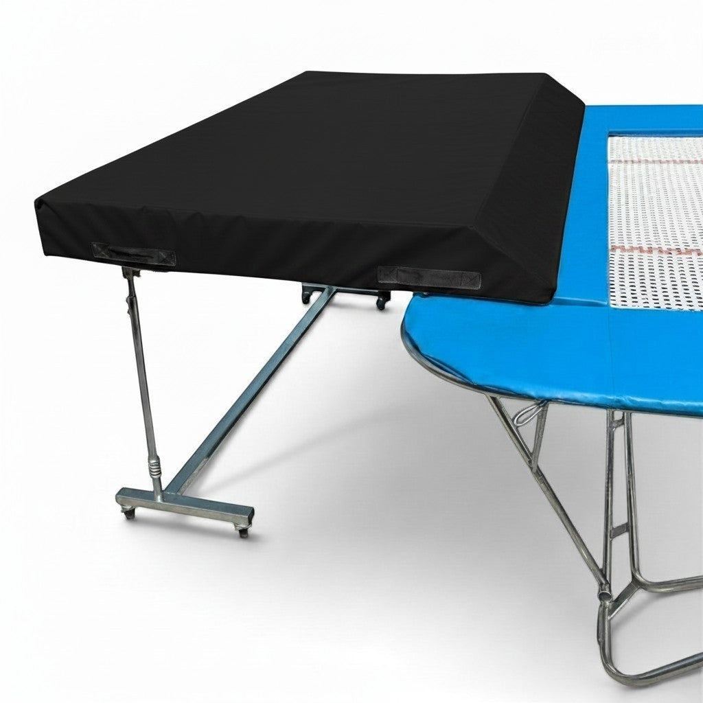 UK Gym Pits international spotting end deck with black safety mat attached to a blue trampoline frame