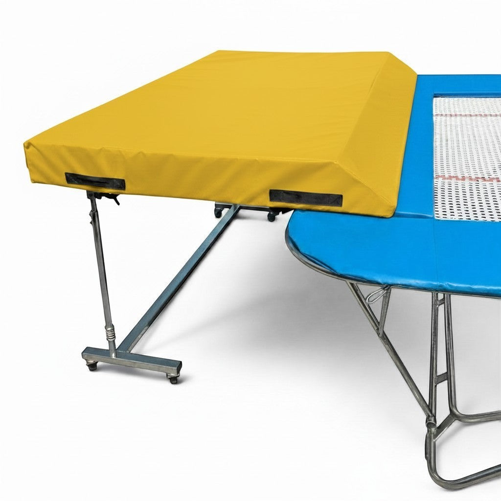 UK Gym Pits standard spotting end deck with a yellow wedged safety mat attached to a blue trampoline frame