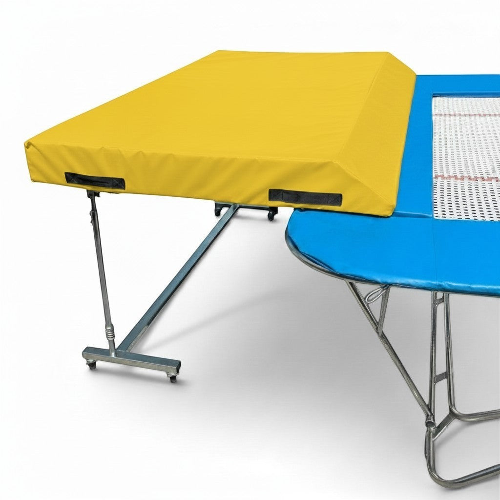 UK Gym Pits international spotting end deck with a yellow safety mat attached to a blue trampoline frame