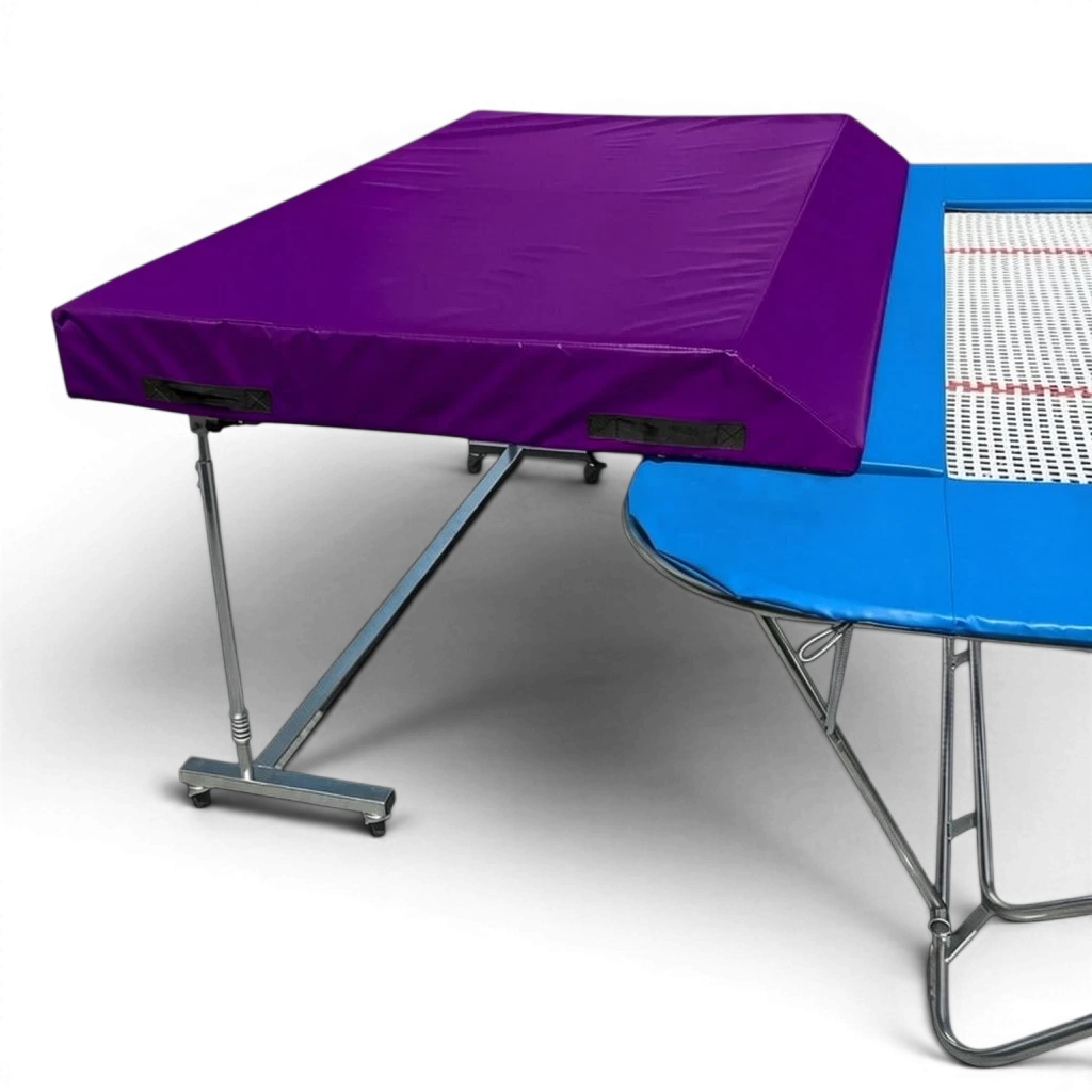 UK Gym Pits international spotting end deck with a purple wedged safety mat attached to a trampoline frame.