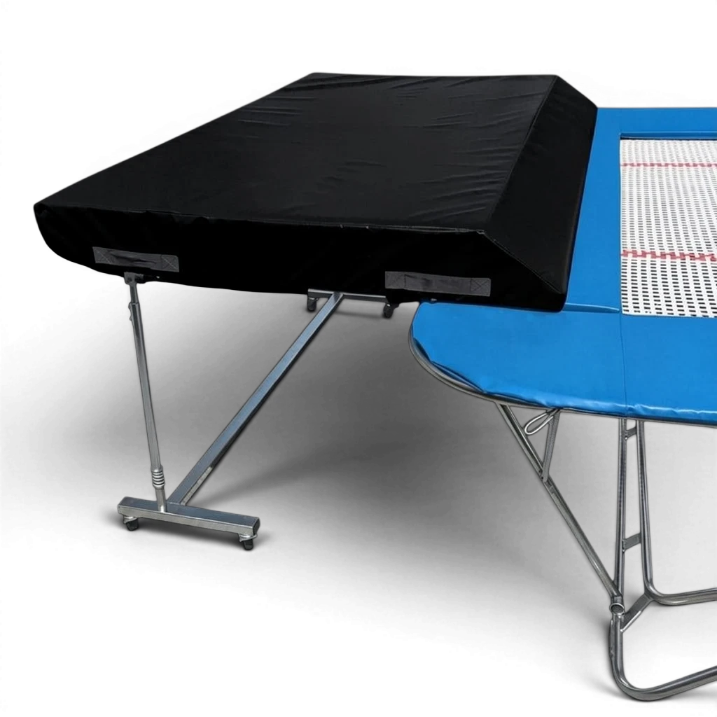 UK Gym Pits international spotting end deck with a black safety mat attached to a blue trampoline frame.