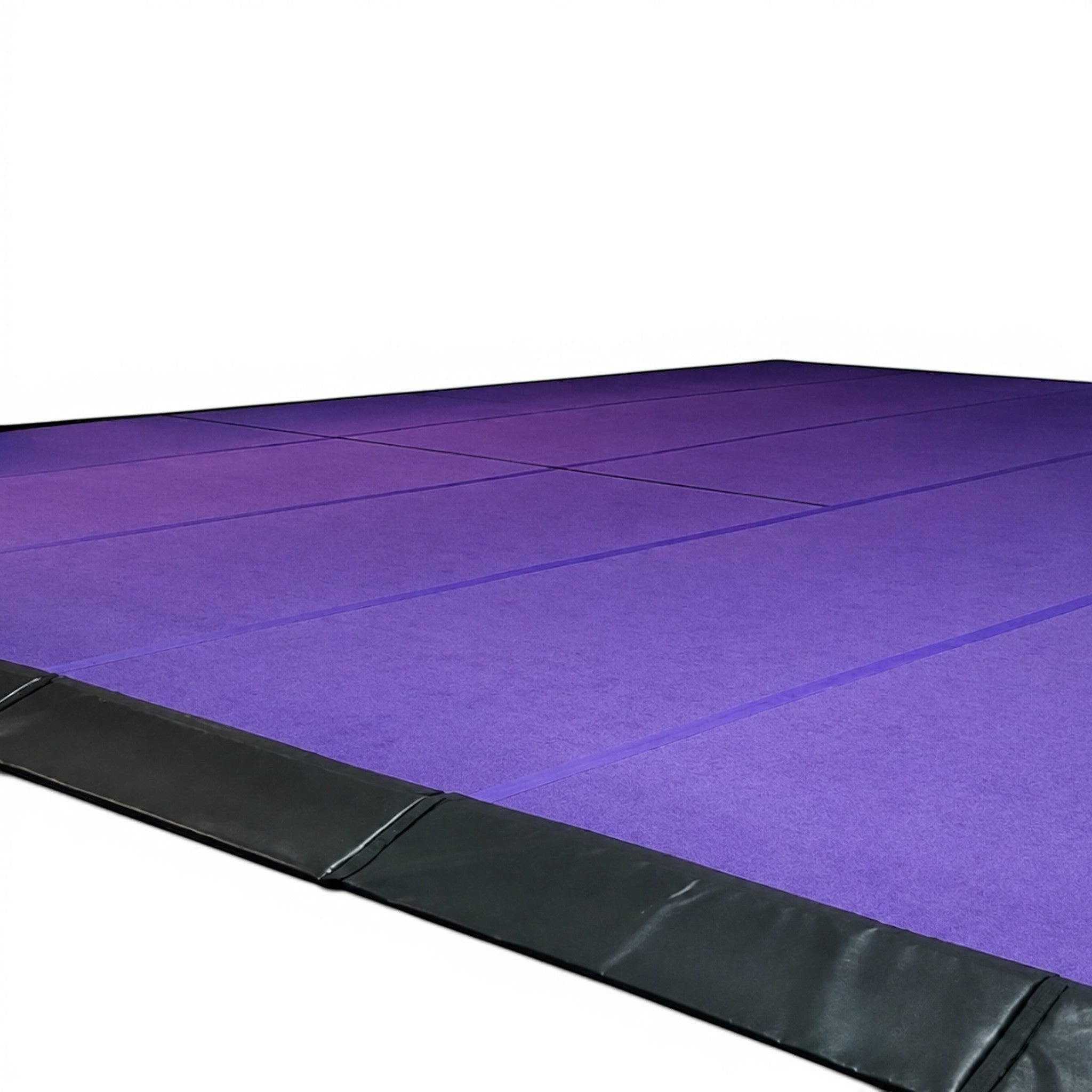 UK Gym Pits black PVC side skirt attached to a purple gymnastics sprung floor with Velcro overflap