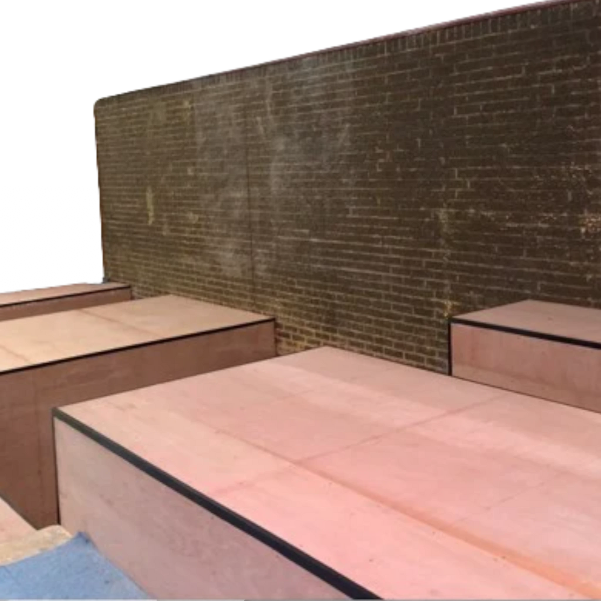 UK Gym Pits sunken pit construction featuring wooden platforms and safety edging installed against a brick wall