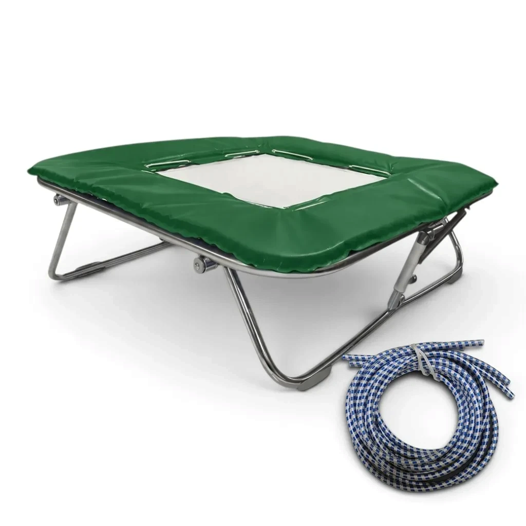 UK Gym Pits super mini trampoline with solid white mesh bed, green frame pads, and a coil of blue rubber cables.