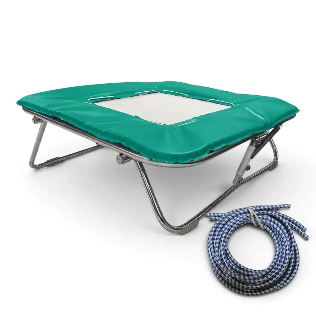 UK Gym Pits super mini trampoline with a solid super-mesh bed, green frame pads, and a coil of blue rubber cables.