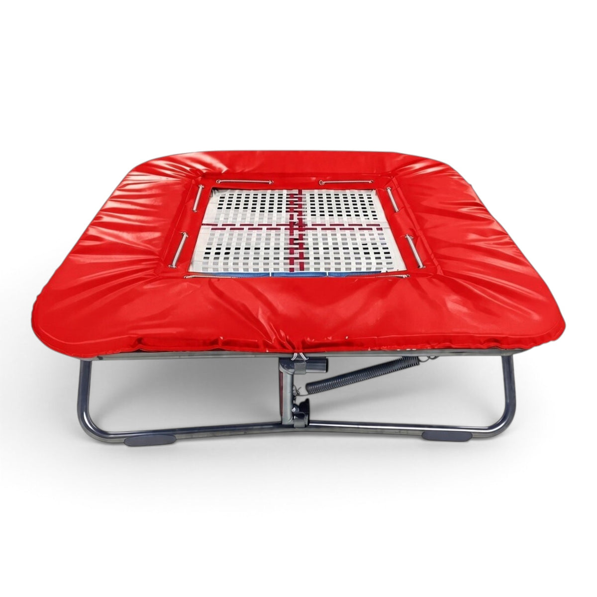 UK Gym Pits super mini trampoline with a white web bed and vibrant red protective frame pads on a zinc plated frame.