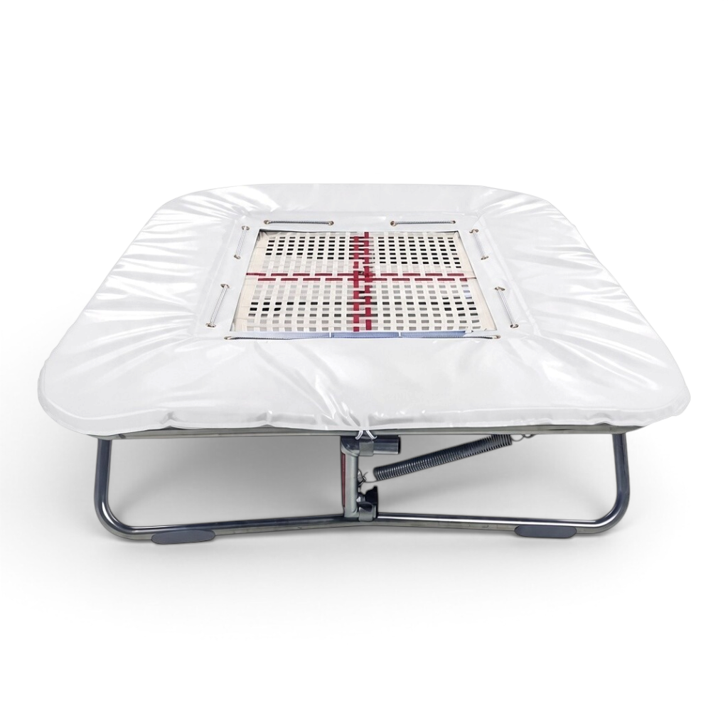 UK Gym Pits super mini trampoline with a white web bed and protective white frame pads on a zinc plated steel frame.