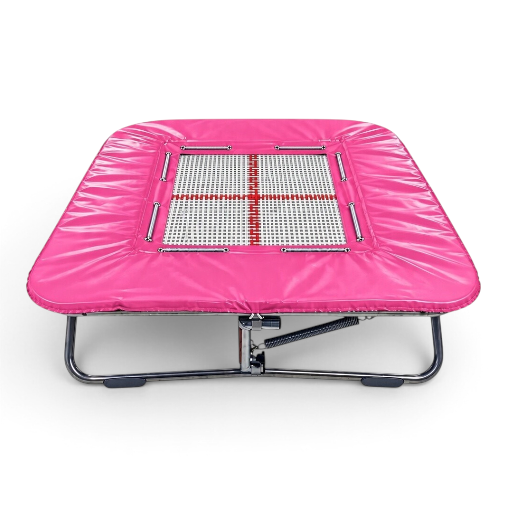 UK Gym Pits super mini trampoline with a white web bed and bright pink protective frame pads on a zinc plated frame.