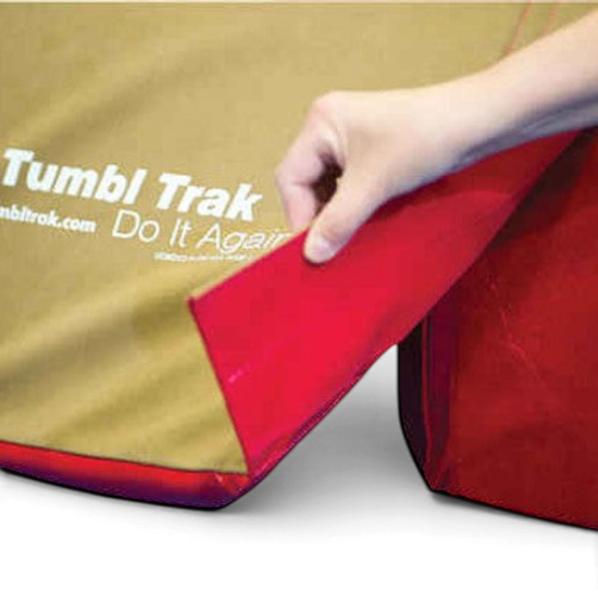 UK Gym Pits T-Trainer suede cover with red underside being attached to a gymnastics vault trainer