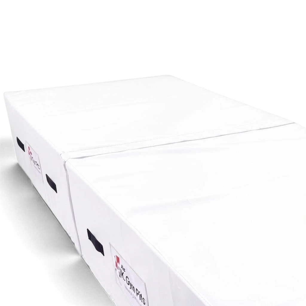 UK Gym Pits white high-density foam track run-up block with heavy-duty handles and anti-slip base for gymnastics.