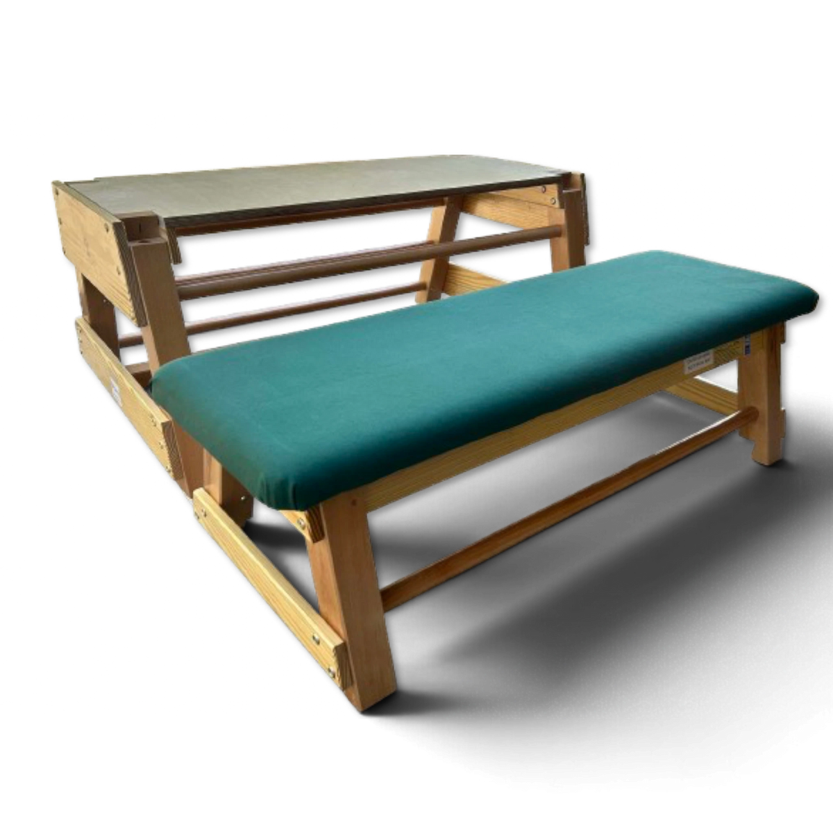 UK Gym Pits wooden gymnastics bar box with a green padded top and integrated rungs for school or club training.