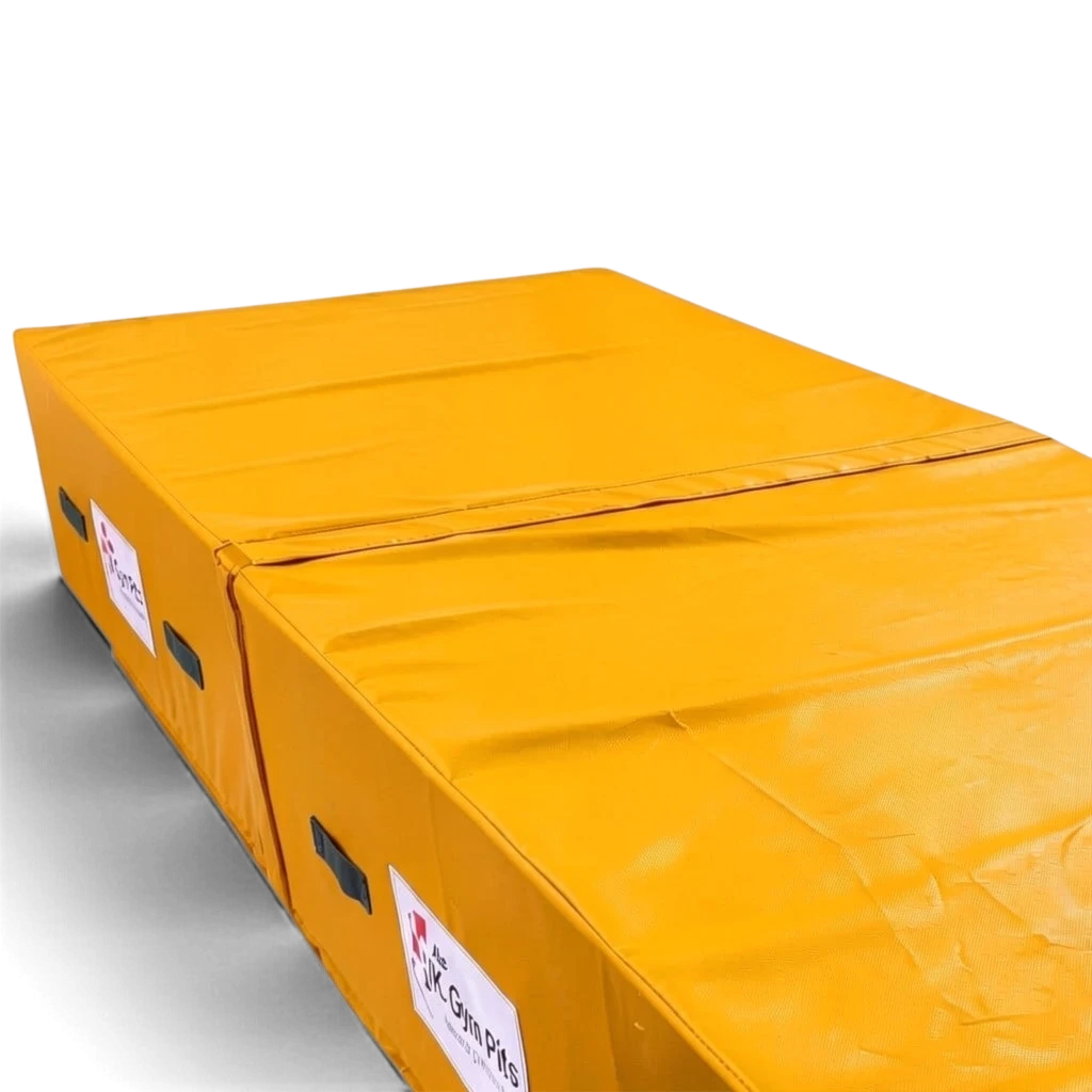 UK Gym Pits yellow high-density foam track run-up block with anti-slip base and heavy-duty handles for gymnastics.