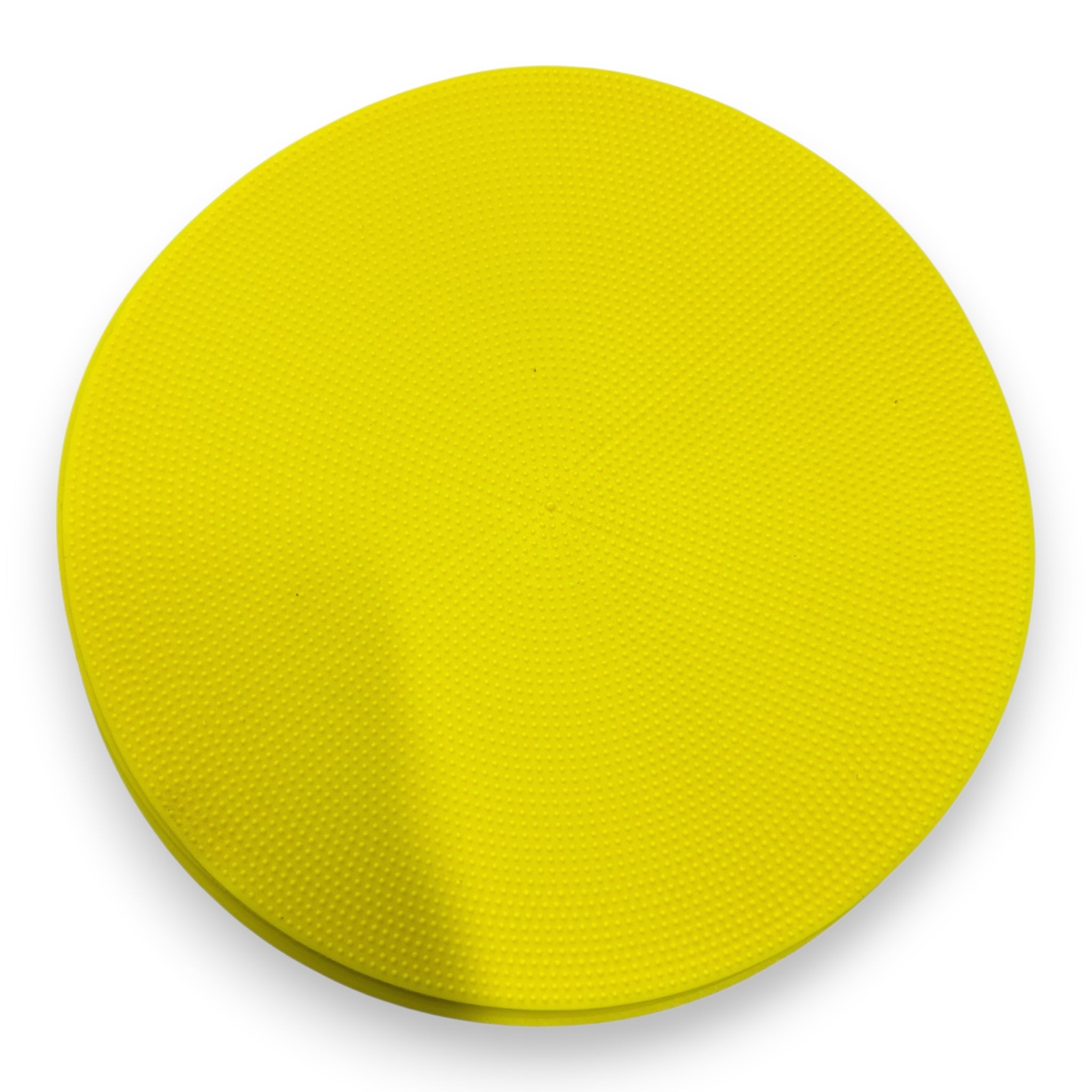 UK Gym Pits yellow circular TPR spot placement marker with a dimpled non-slip surface for sports and training.