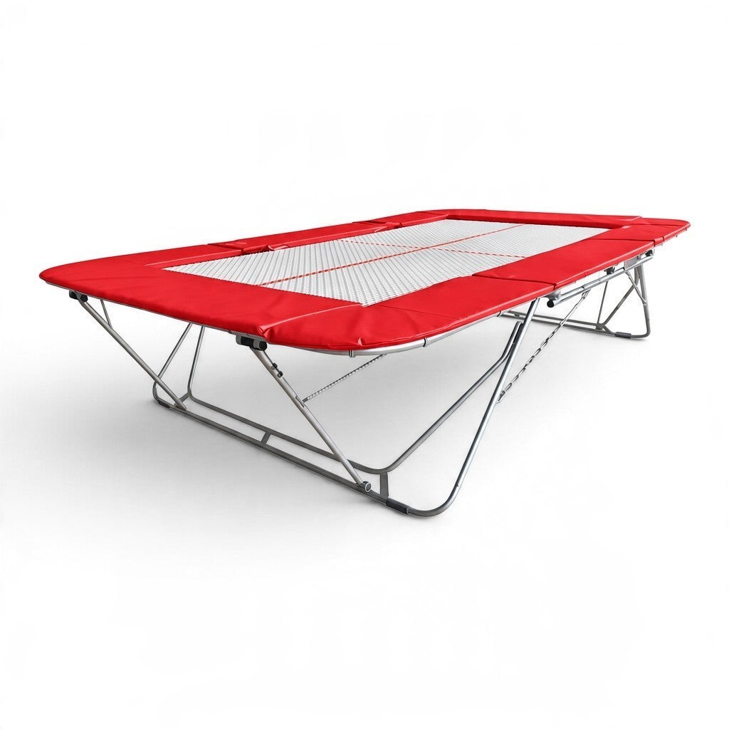 UK Gym Pits 77a standard competition trampoline with a 25mm web bed and red protective frame pads on a white background