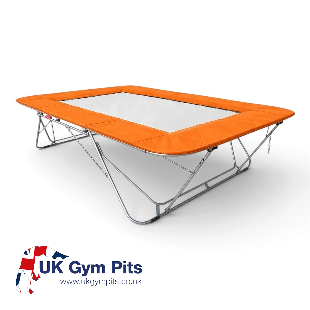 UK Gym Pits 77a standard trampoline with a white super-mesh bed and bright orange protective frame pads
