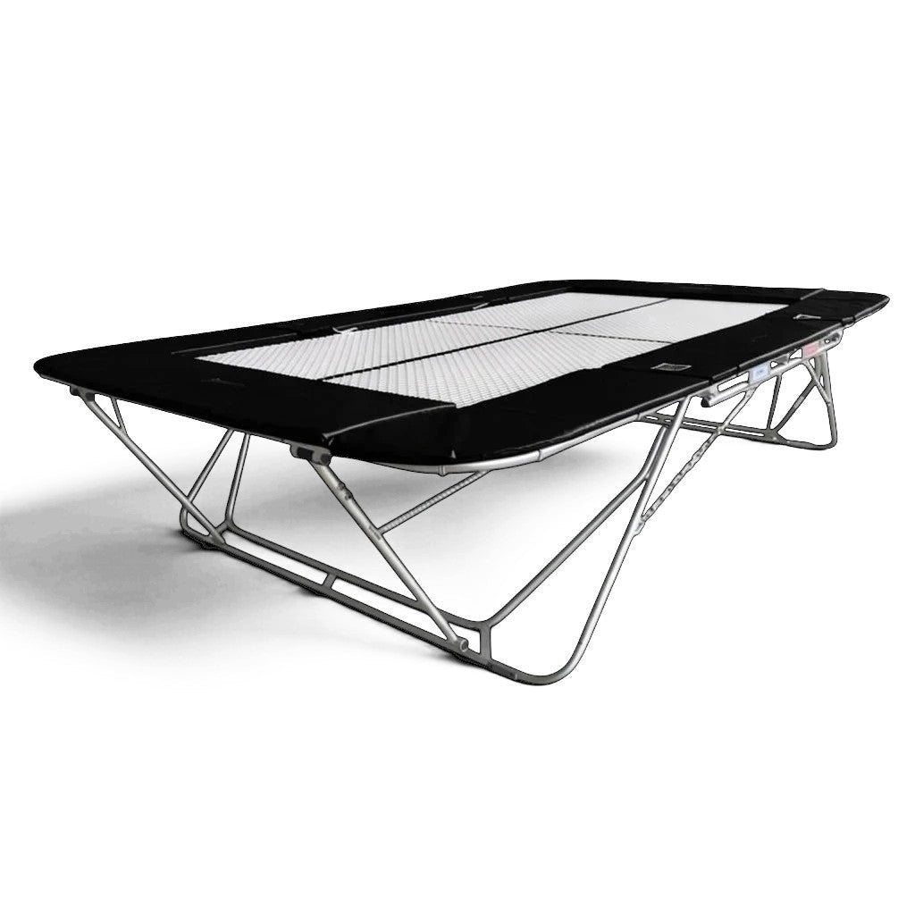 UK Gym Pits 77a standard trampoline with a white super-mesh bed and black protective frame pads on a steel frame.