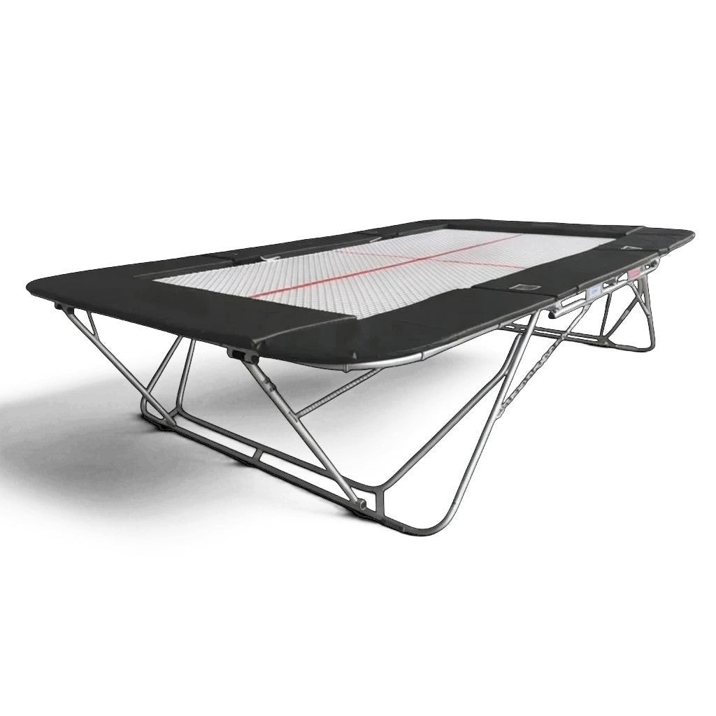 UK Gym Pits 77a standard competition trampoline with a white super-mesh bed and black protective frame pads.