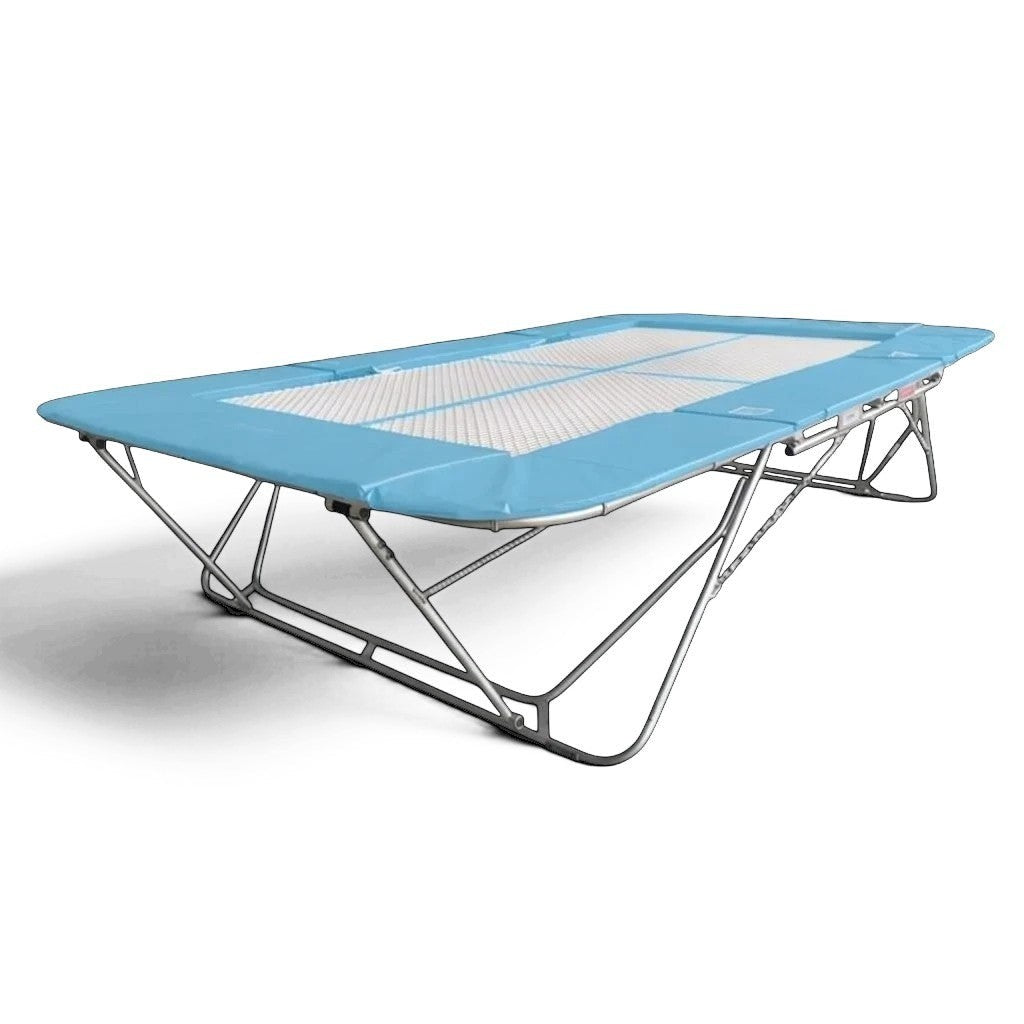 UK Gym Pits 77a standard trampoline with a white super-mesh bed and light blue protective frame pads on a steel frame.