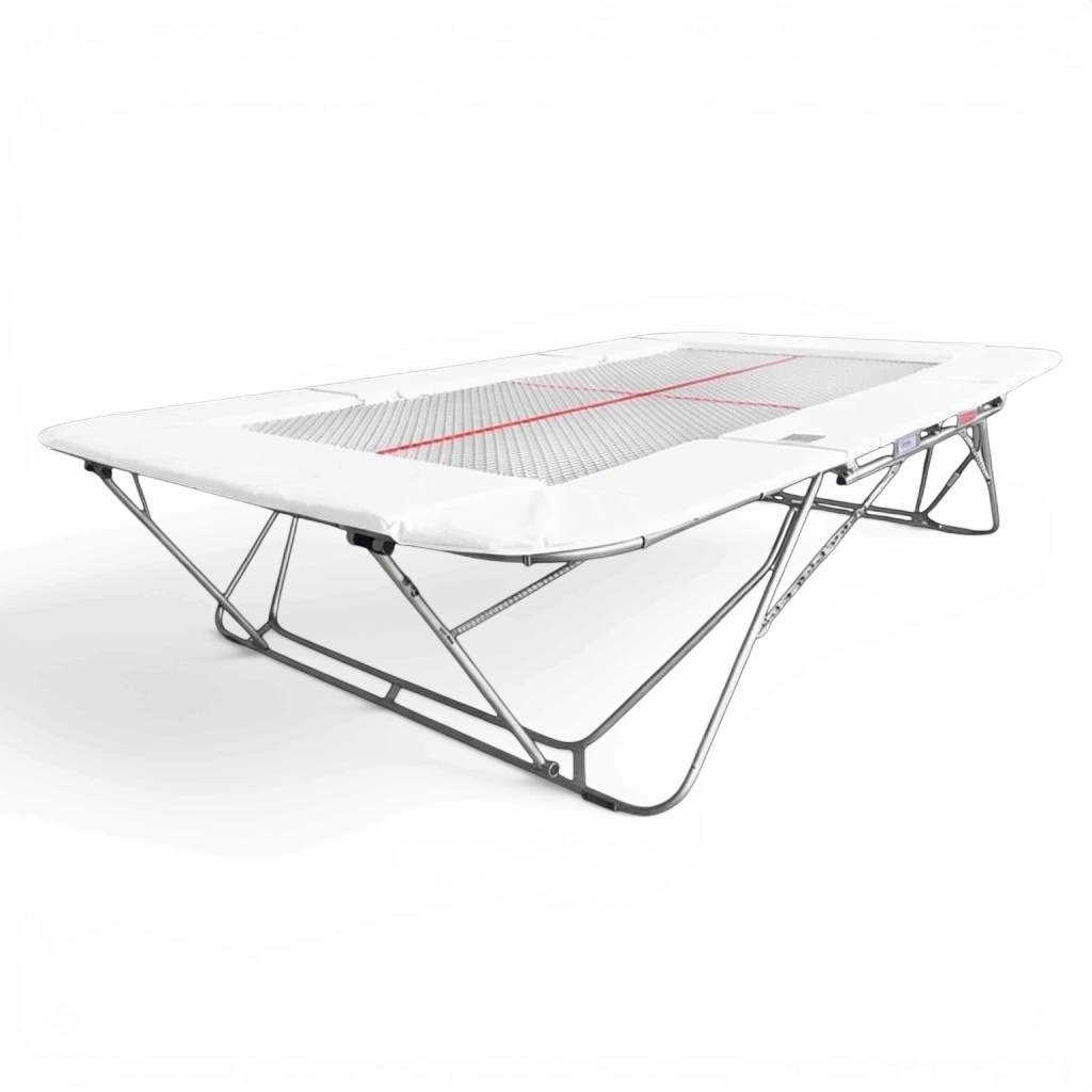 UK Gym Pits 77a standard competition trampoline with a 13mm web bed and white protective frame pads.