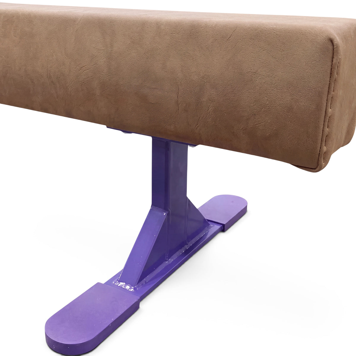 UK Gym Pits Addie Beam with purple metal leg risers, featuring a brown synthetic suede surface for home training.