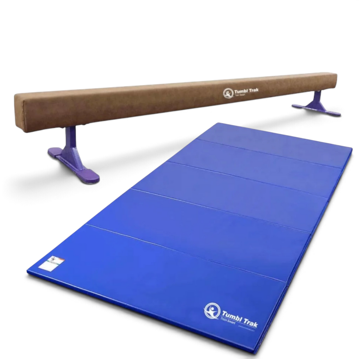 UK Gym Pits Addie Beam with purple leg risers and a blue folding tumbling mat for home gymnastics training.