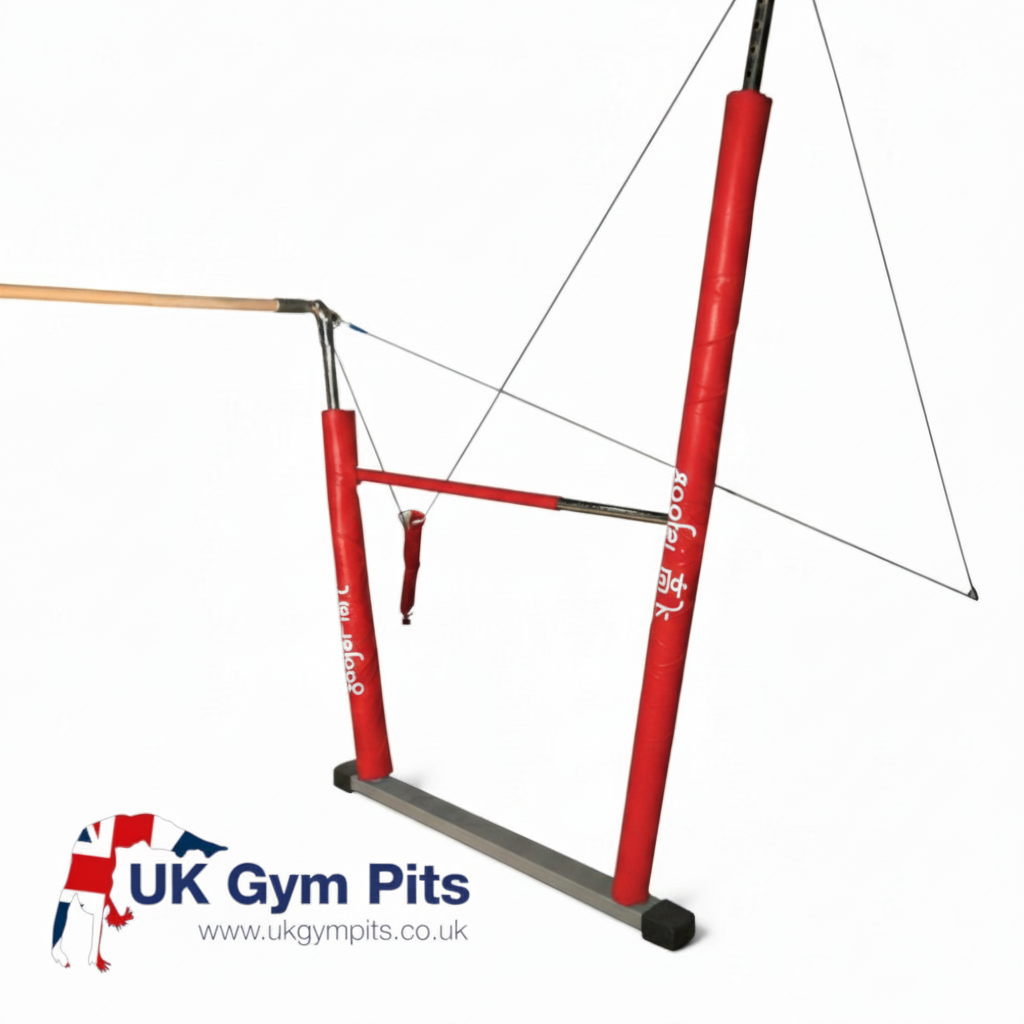 UK Gym Pits red PVC vinyl safety padding installed on asymmetric gymnastics bar uprights with Velcro securement