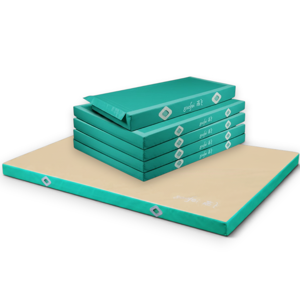 UK Gym Pits Gaofei FIG approved asymmetric bars landing mats in teal and beige with non-slip base and Velcro flaps.