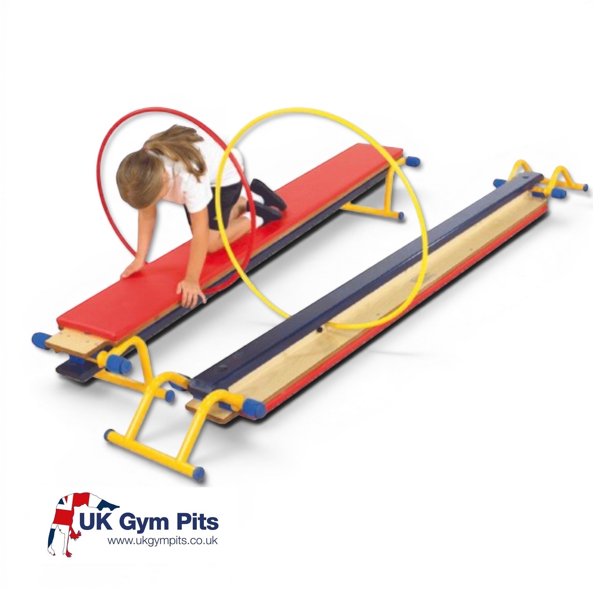 UK Gym Pits Gym Time Balance Bench with red padded top, yellow hoops, and natural timber frame for gymnastics training