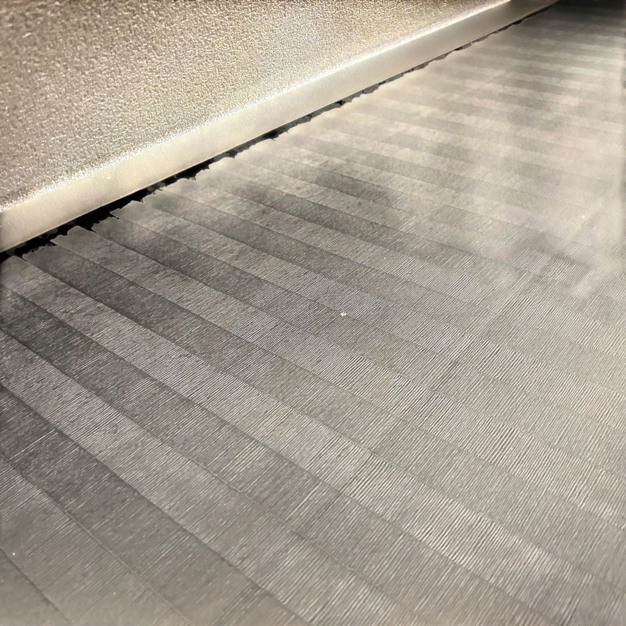 UK Gym Pits black Hybrid Connect mat roll with a durable tatami-textured PVC surface for gymnastics and martial arts.