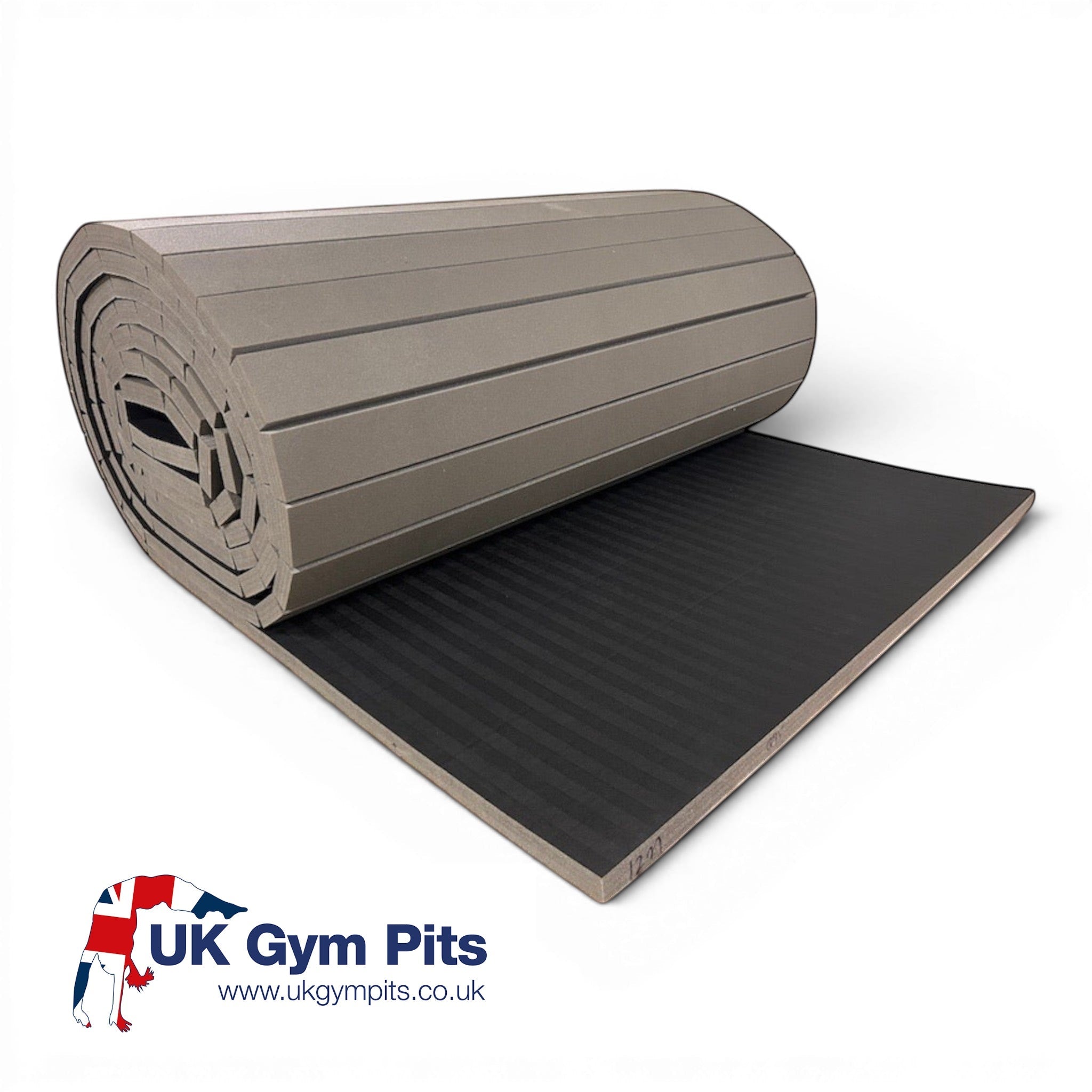 UK Gym Pits 12m black hybrid mat roll with durable tatami-style PVC surface and shock-absorbing XPE foam for training.