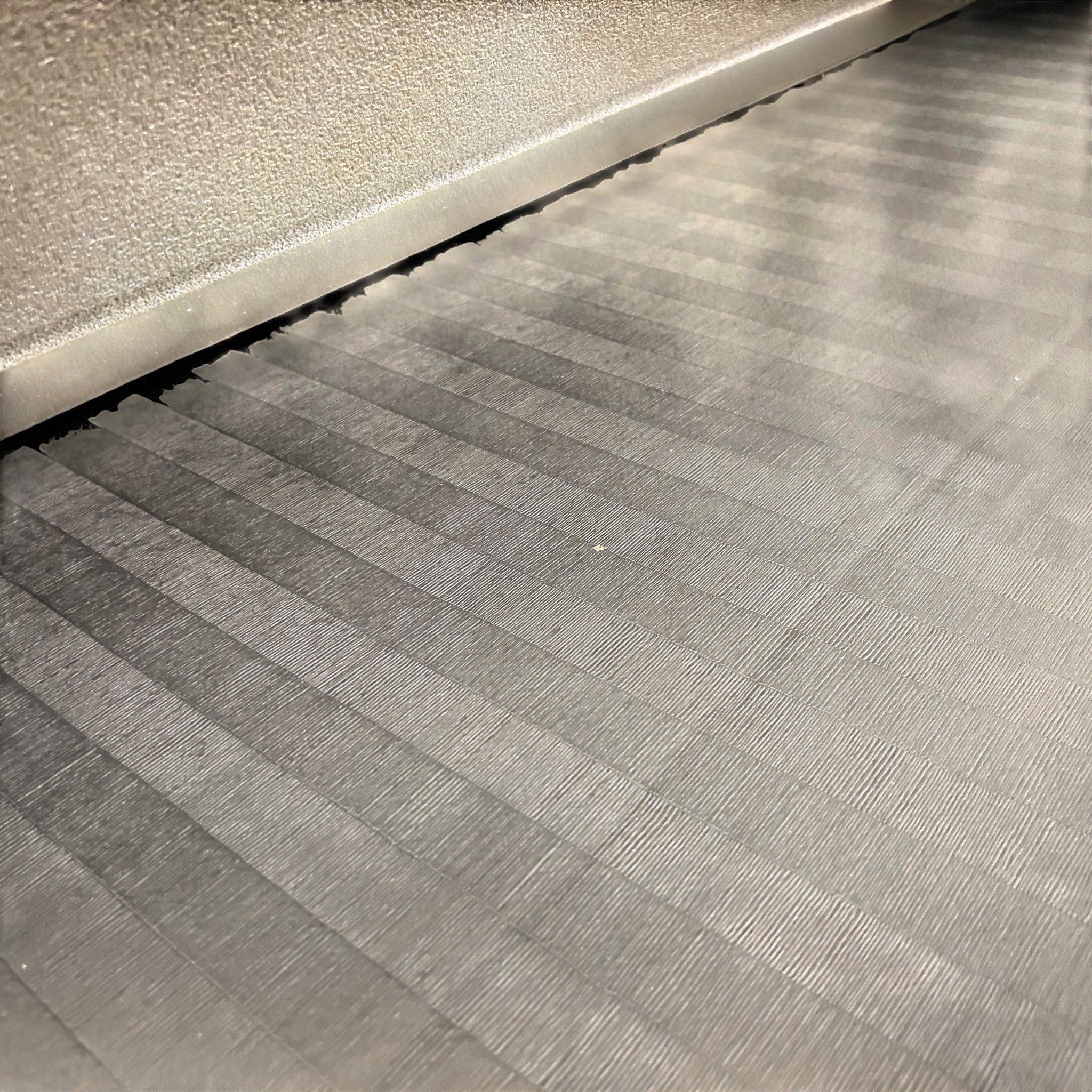 UK Gym Pits black hybrid mat roll featuring a durable tatami-textured PVC surface for gymnastics and martial arts.