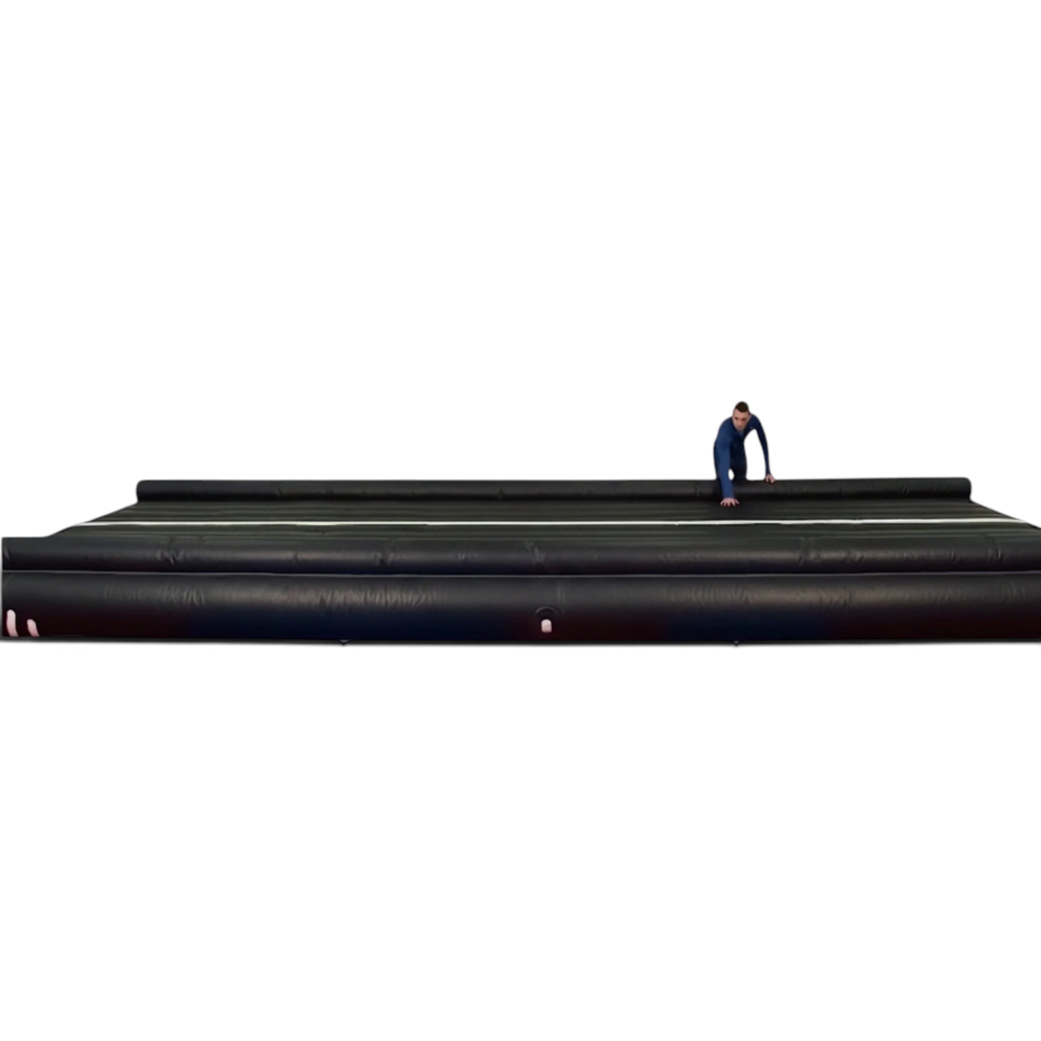 UK Gym Pits black inflatable air trak for gymnastics training with an athlete demonstrating the surface