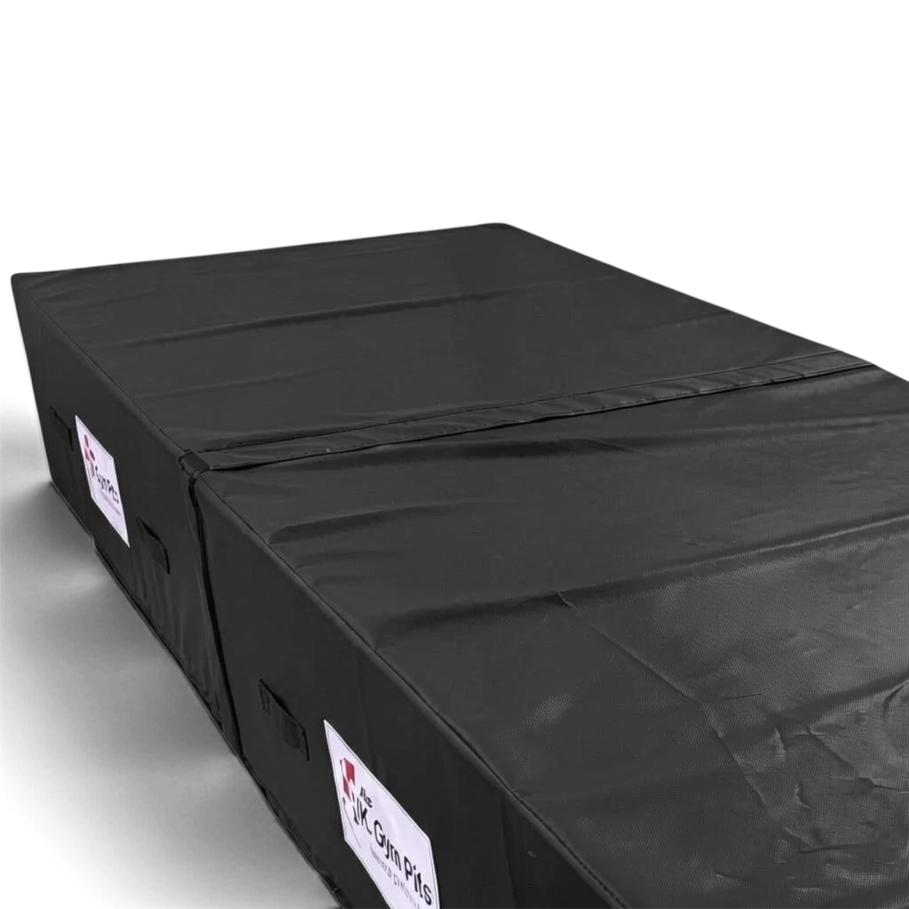UK Gym Pits black heavy-duty foam track run-up block with anti-slip base and transport handles for gymnastics