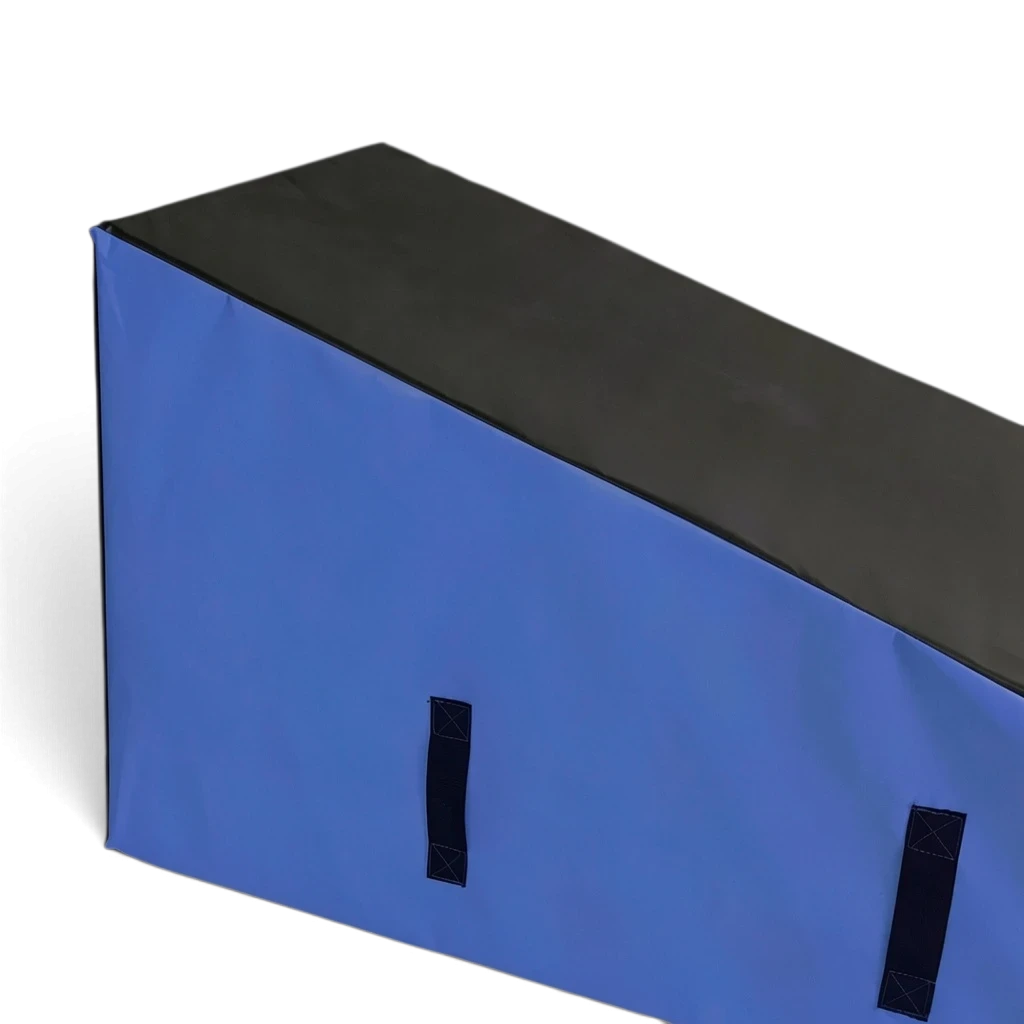 UK Gym Pits parkour wedge block with black top and blue sides, featuring durable PVC and carry handles for training.