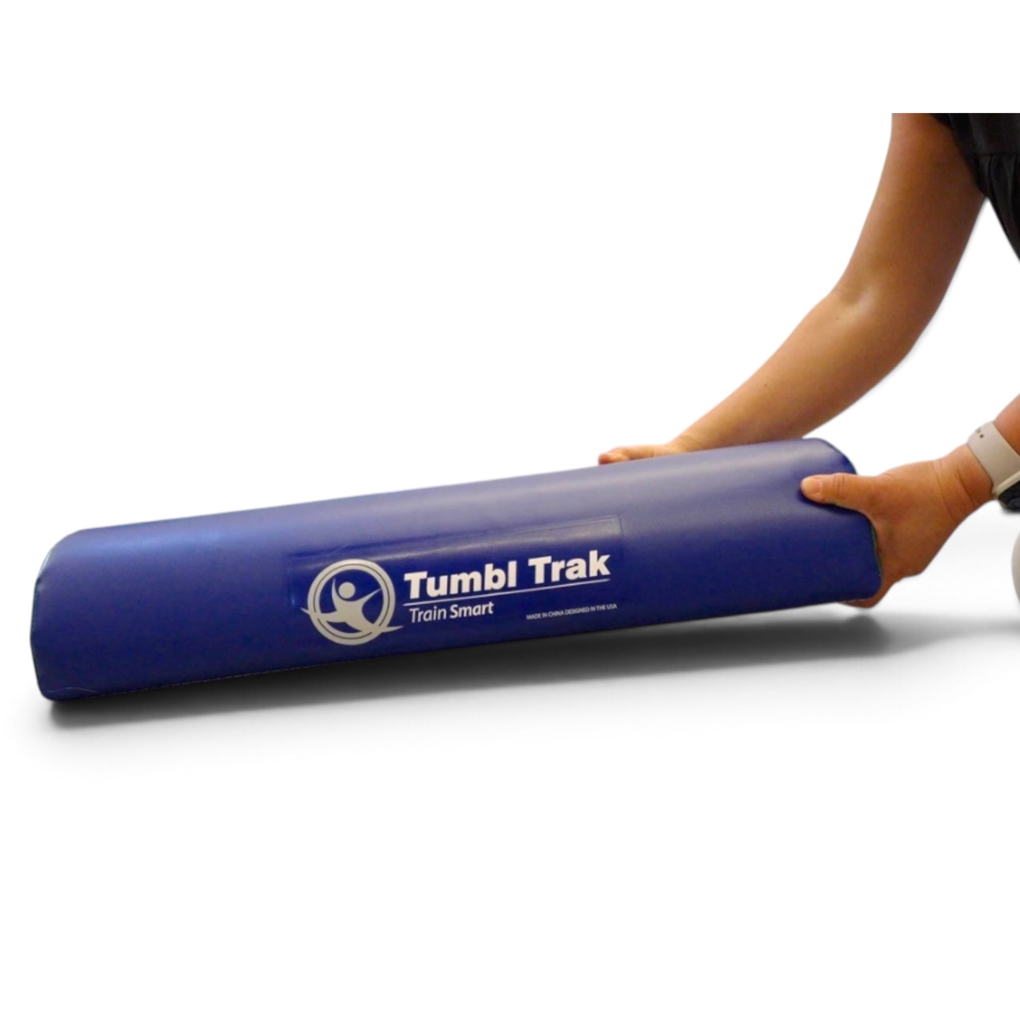 UK Gym Pits blue vinyl foam half round training tool with Tumbl Trak logo being held by a person